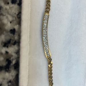 Michael Kors necklace with gold plated chain and parfait stones on bar